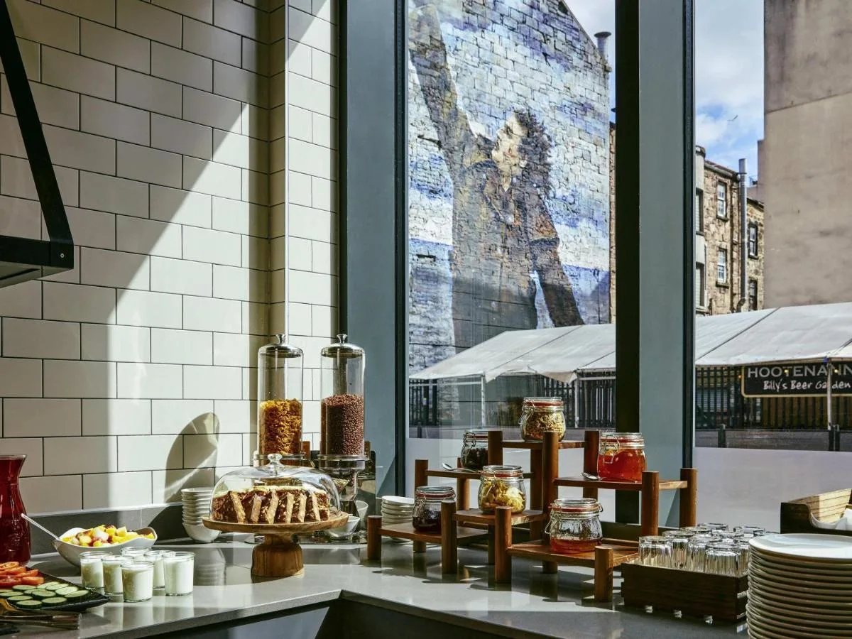 a display of food on a counter next to a window at Aparthotel Adagio Glasgow Central in Glasgow